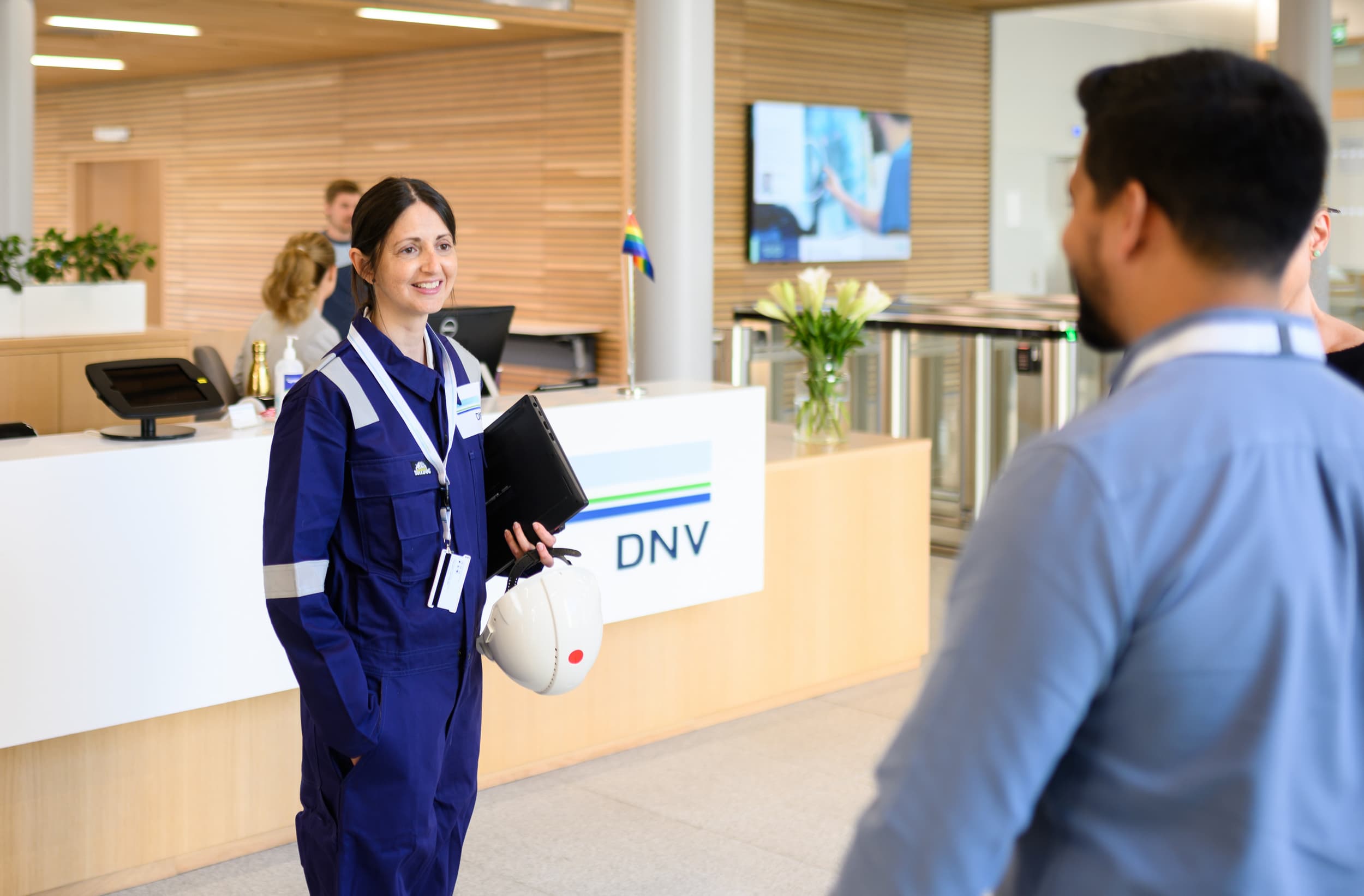 Synergi Life users and colleagues talk in DNV office