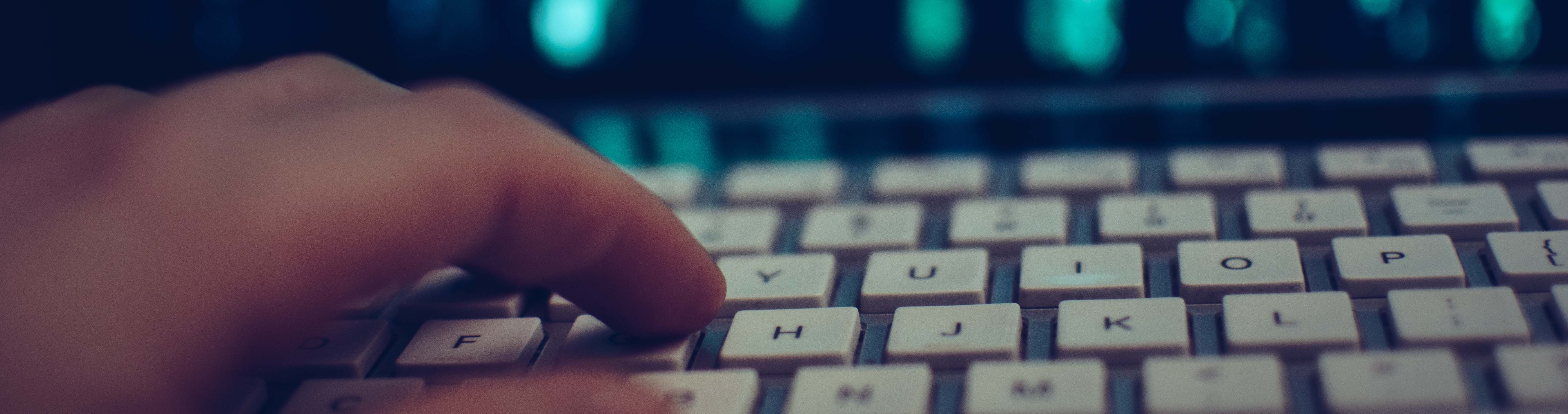 Typing on laptop